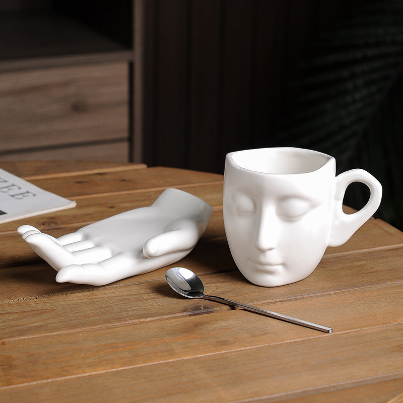 Face in Hand Ceramic Coffee Cup Set
