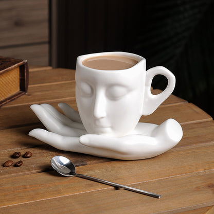 Face in Hand Ceramic Coffee Cup Set